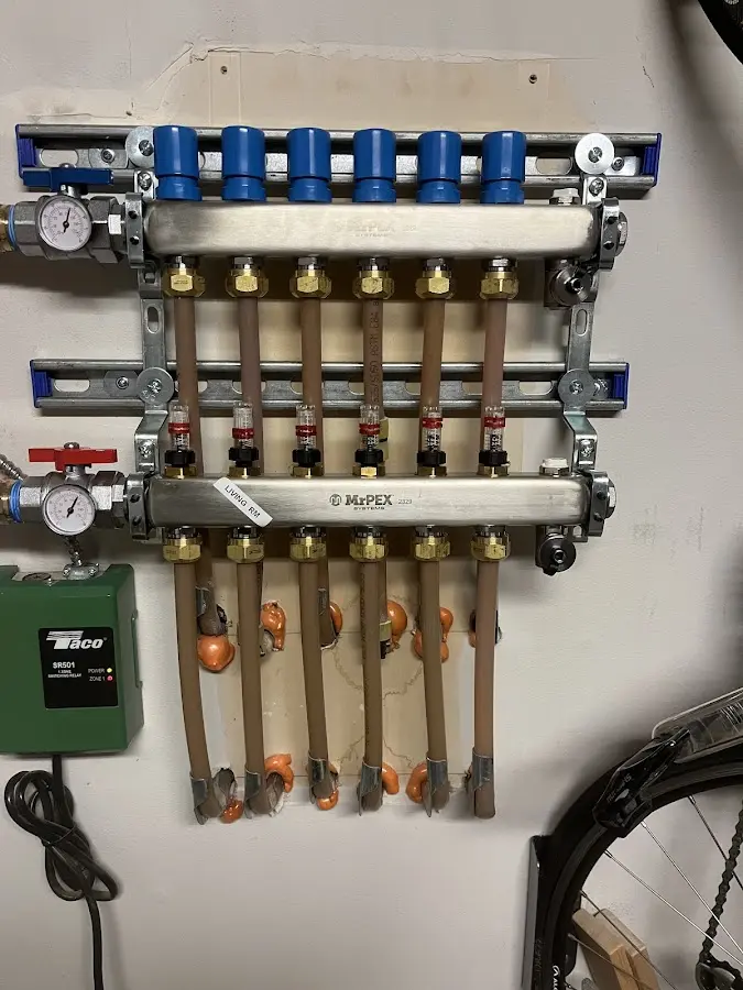 Plumber performing Water Heater Repair at a residential property in Hayesville